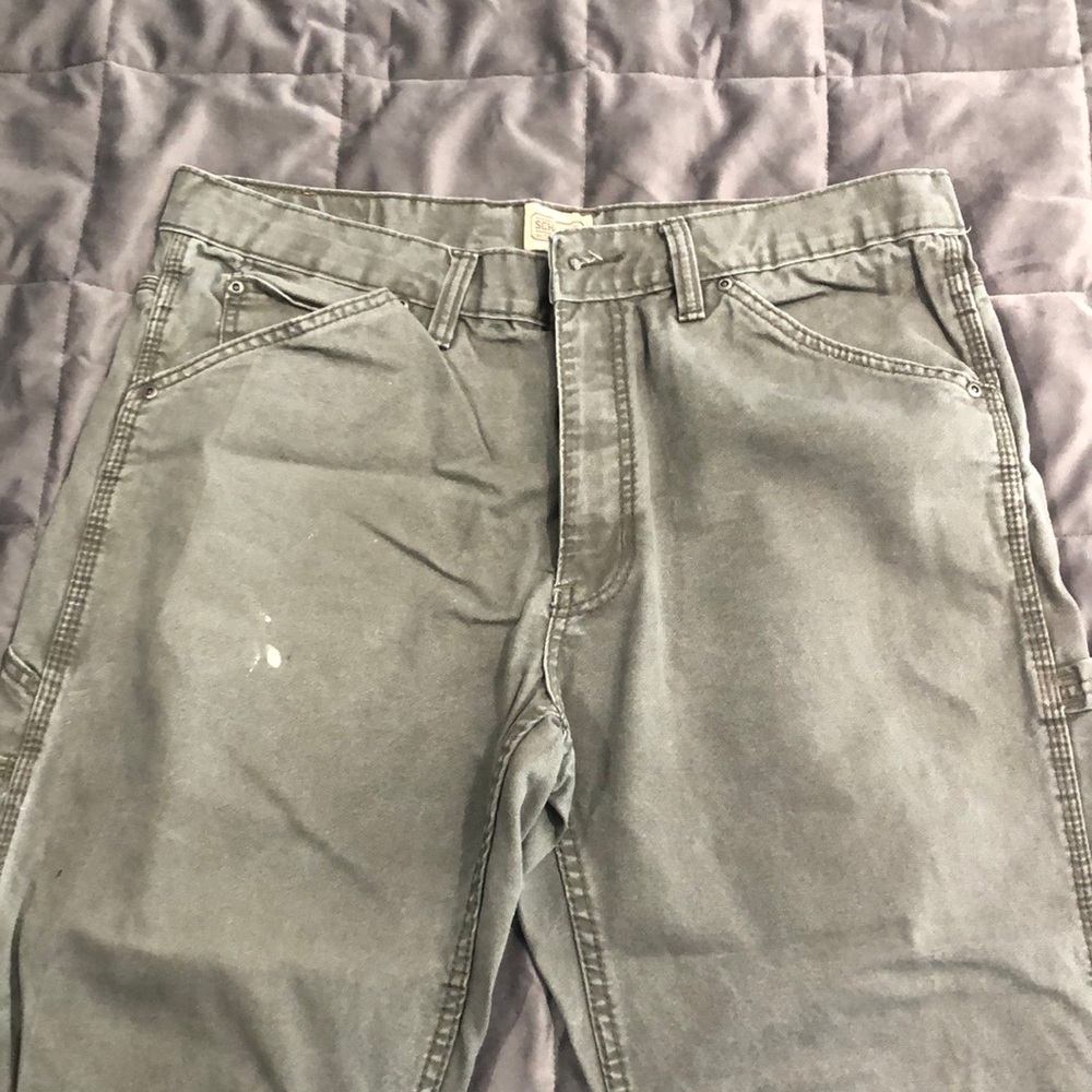 Schmidt workwear, 36x30, green, two spots of white paint